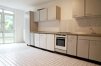 Picture of a kitchen and common room in the 3-person shared apartment in Weisenau