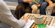 Photo of a consulting situation of parents with kid in Studierendenwerk Mainz Campus-Kitas Kita-Sozialarbeit